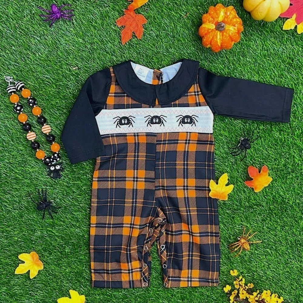Orange Black and white plaid smocked romper with embroidered spiders NWOT
